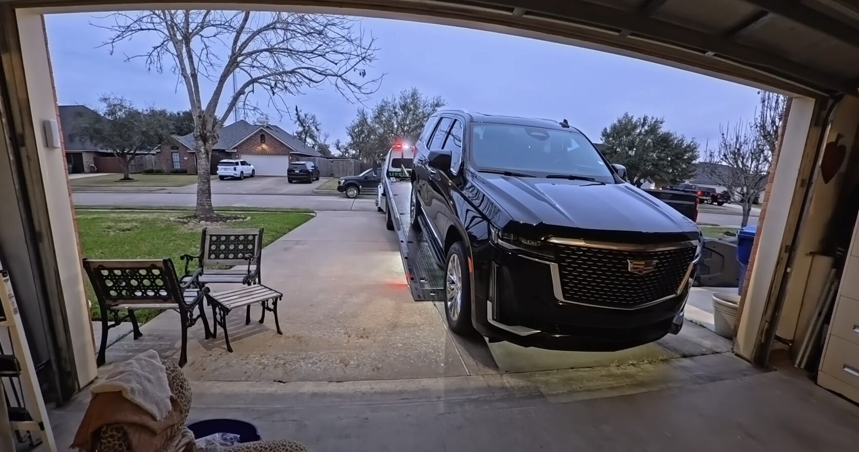 Reliable towing service arriving at customer location Professional tow truck arriving at residential location for vehicle pickup