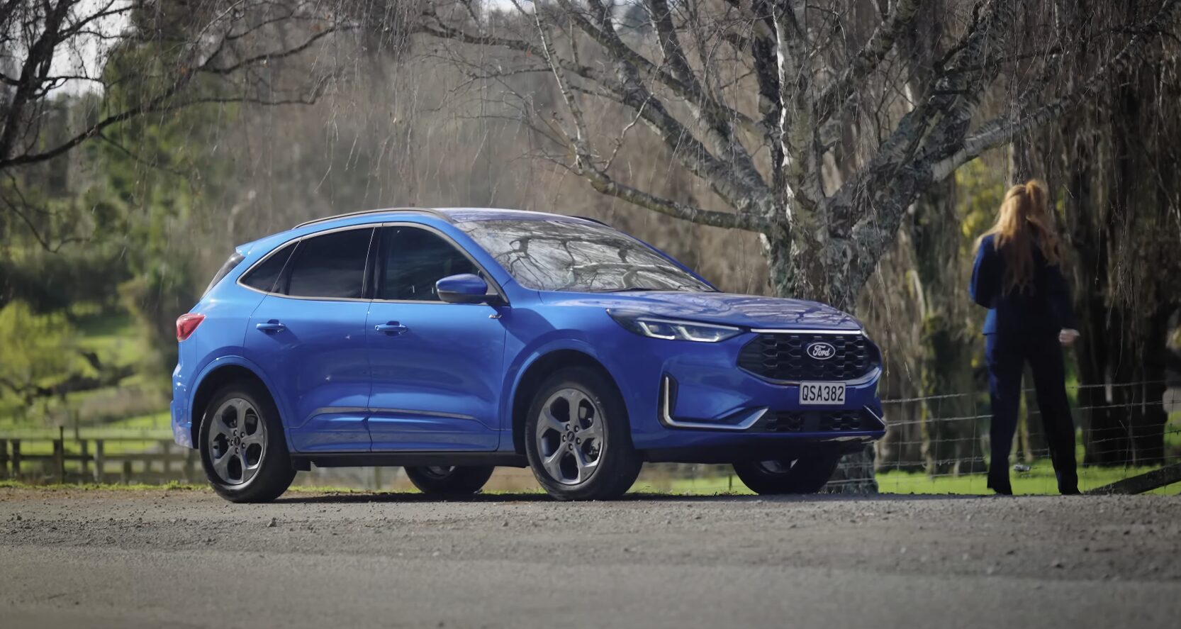 Professional vehicle recovery and towing services Blue SUV being professionally towed after roadside breakdown